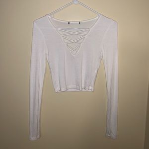 A white, cropped long sleeve shirt